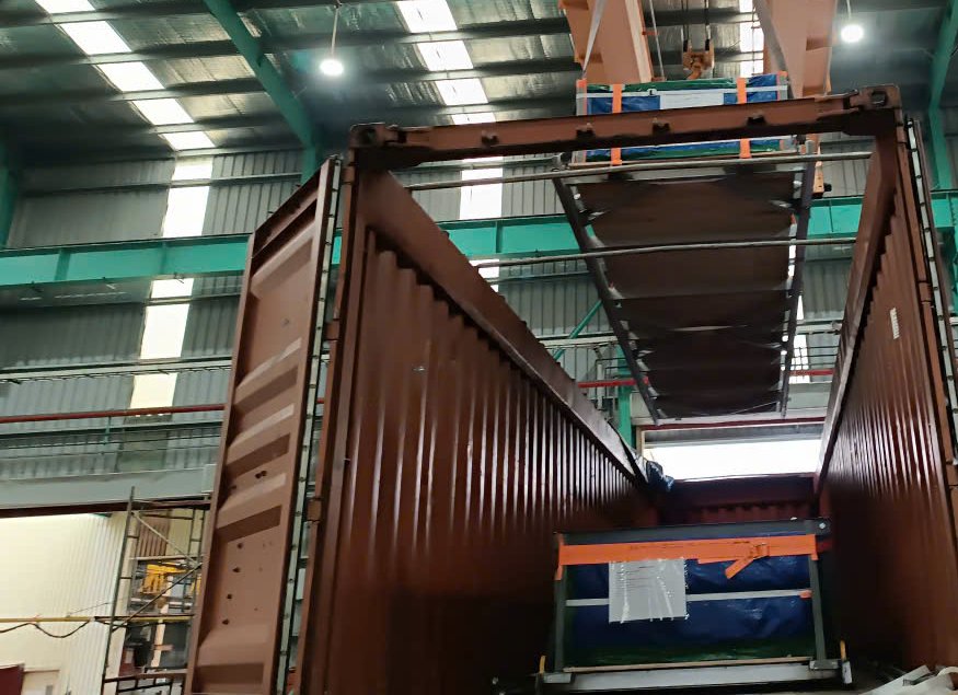 (Lowering steel spacers into 40OT containers)